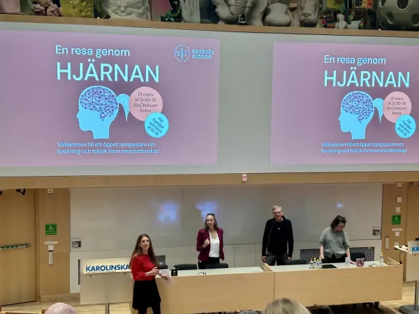 A lecture hall with audience and speaker