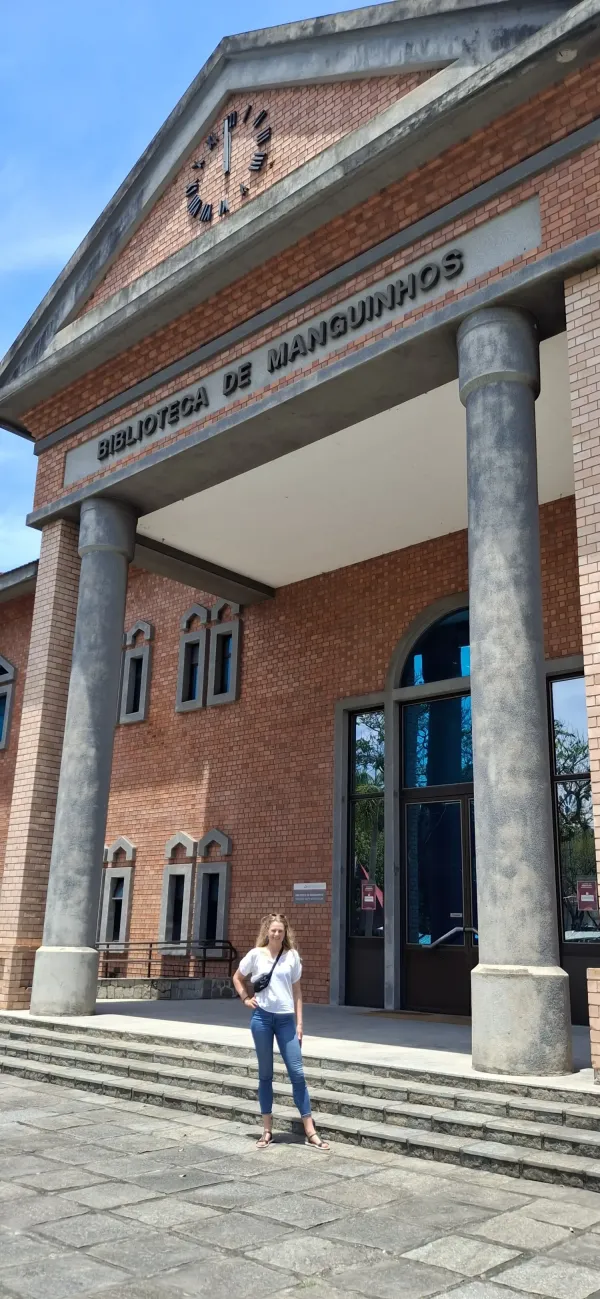 Pernilla stands in front of the foundation's library