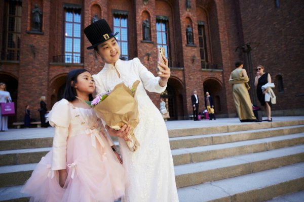 New doctor Jieln Lin with her daughter Yiyi Li outside Stockholm City Hall.