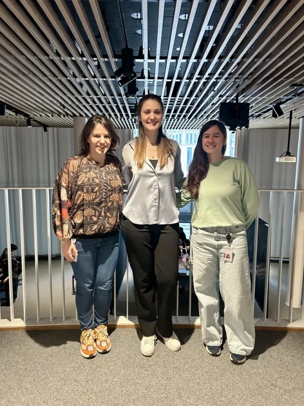 Three persons posing for the picture