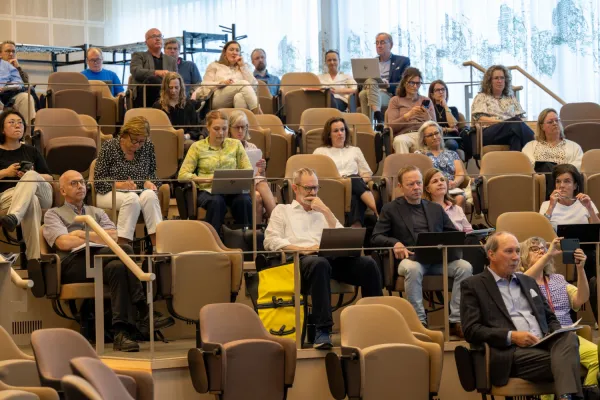 Participants at the KIRA seminar in a spacious hall at Biomedicum