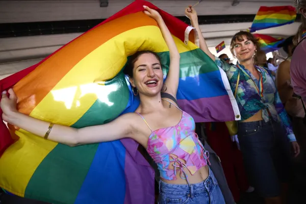 Gaiana Frank wrapped in a big rainbowflag.