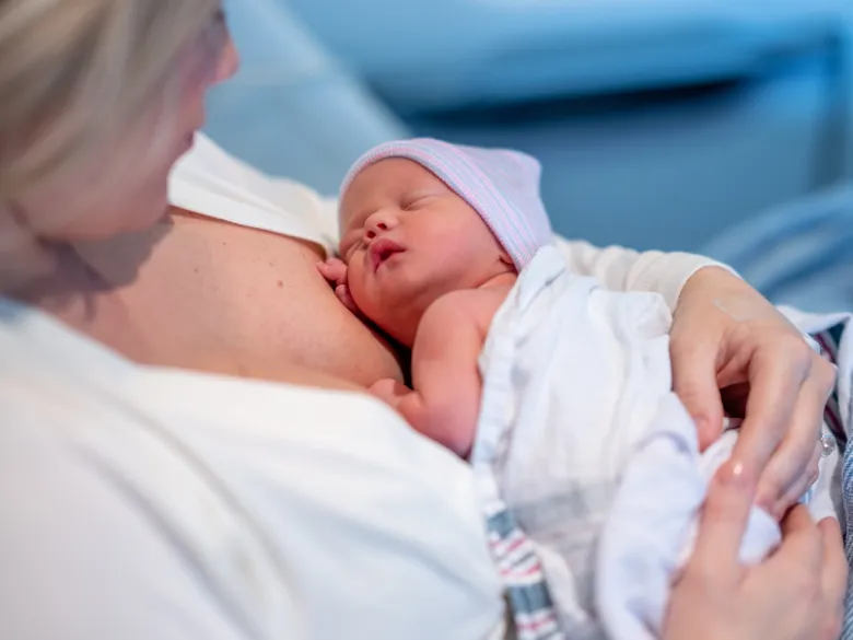 A mother with a newborn baby