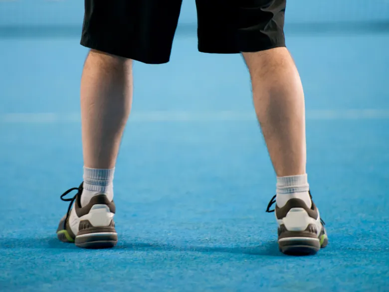Feet on tennis court