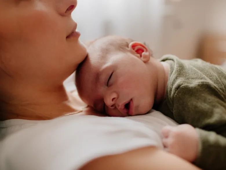 Mother holding her newborn baby