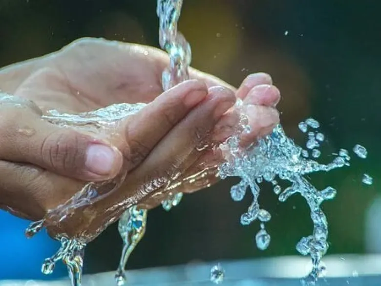 Hands trying to capture water