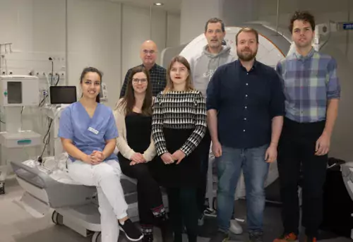 A group picture of seven researchers in hospital environment