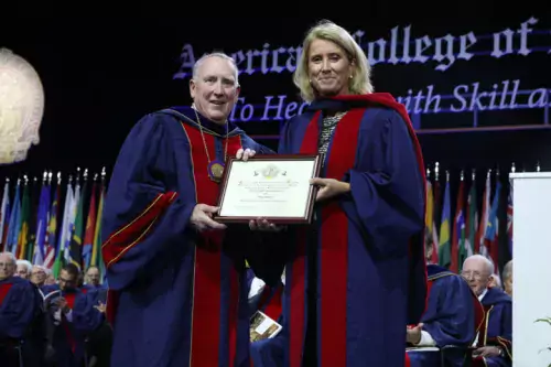 Professor Anna Martling receives the diploma