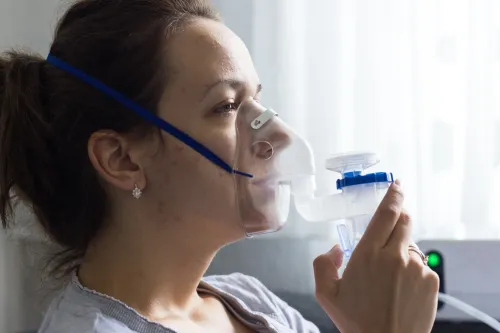 Person receiving respiratory assistance during an asthma attack,