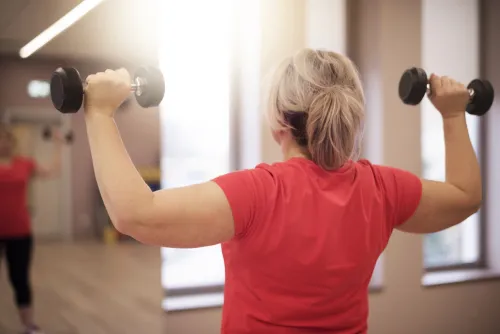 Woman lifting weights.