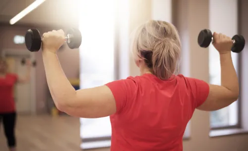 Woman lifting weights.