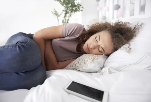 Teenage girl with stomach ache