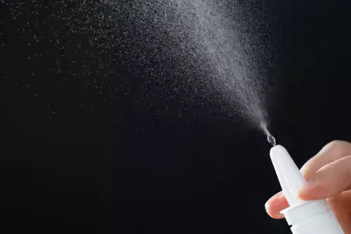 Decorative, genre picture showing spray from a nasal spray.