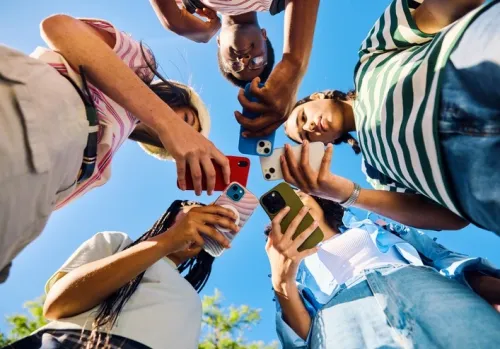 Young people looking at their phones