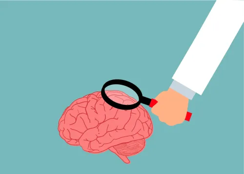 illustration of a hand holding a looking glass over a brain.