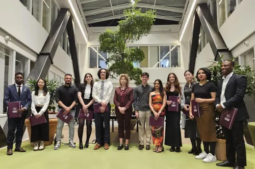 12 of the 13 scholarship holders together with KI president Annika Östman Wernerson in Aula Medica.