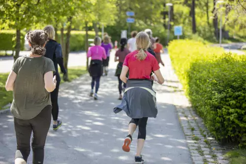 Group of people running on campus Solna.