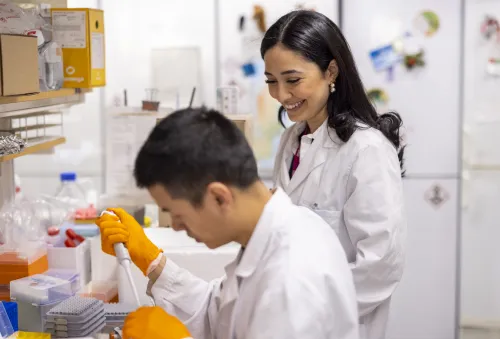 Woman and man in lab environment working together.