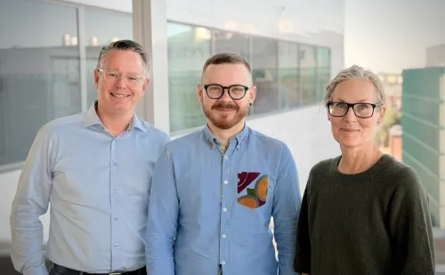 Portrait of three researchers at MMK