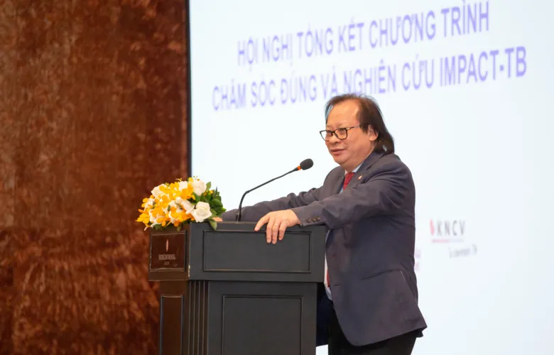 Associate Professor Nguyen Viet Nhung standing talking at a podium.